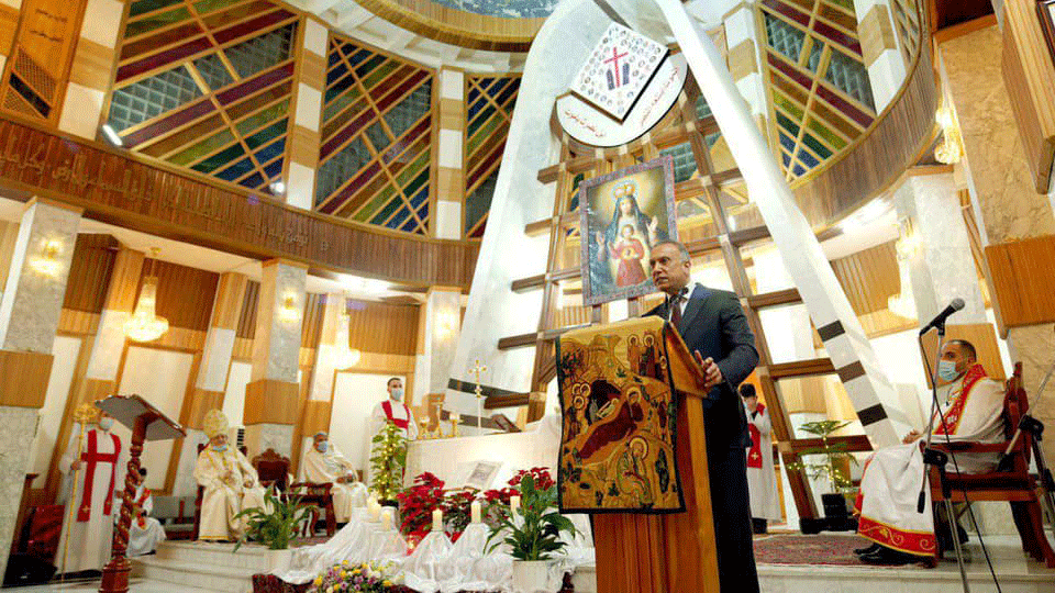 الكاظمي متحدثا خلال حضوره قداس الميلاد في بغداد مساء الخميس