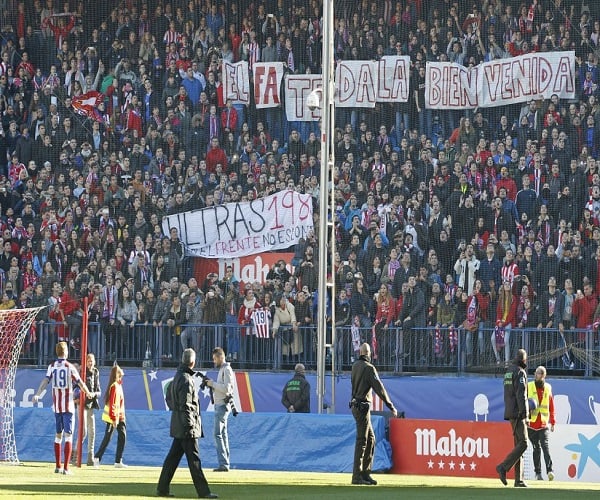 Real Madrid supporters gesture, prior to the Champions League final soccer match between Atletico Madrid and Real Madrid in downtown Lisbon, Portugal, Saturday, May 24, 2014. (AP Photo/Andres Kudacki)