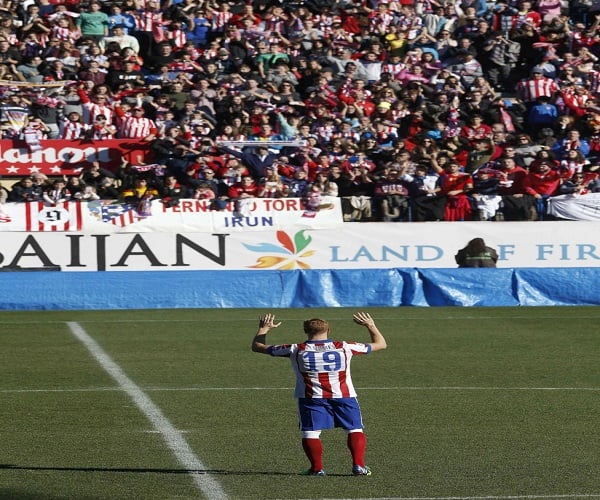 Real Madrid supporters gesture, prior to the Champions League final soccer match between Atletico Madrid and Real Madrid in downtown Lisbon, Portugal, Saturday, May 24, 2014. (AP Photo/Andres Kudacki)