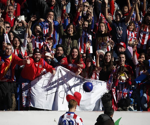 Real Madrid supporters gesture, prior to the Champions League final soccer match between Atletico Madrid and Real Madrid in downtown Lisbon, Portugal, Saturday, May 24, 2014. (AP Photo/Andres Kudacki)