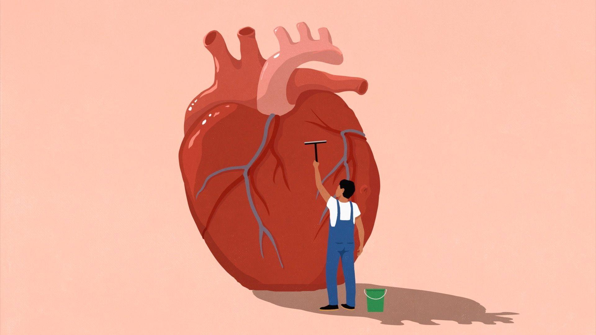رسم توضيحي لرجل يستخدم ممسحة لتنظيف قلب كبير. - Getty Images