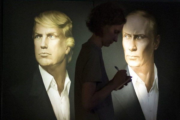 صورتان بورتريه في واحدة من الحانات في موسكو، فهل يمكن أن يتعاون ترامب وبوتين بشأن الوضع في سوريا؟