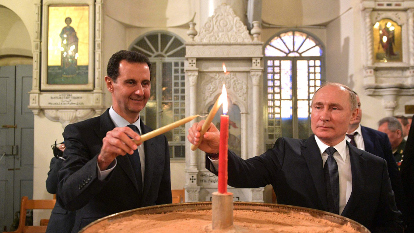 الرئيس الروسي فلاديمير بوتين والرئيس السوري السابق بشار الأسد