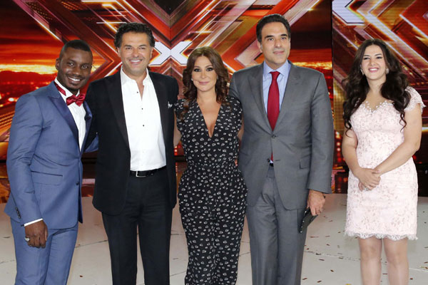 حمزة هوساوي مع مازن حايك وأعضاء لجنة التحكيم بعد تتويجه فائزاً بلقب The X Factor