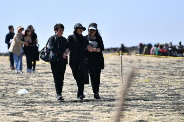 اسر احدى الضحايا الصينيين في موقع تحطم طائرة البوينغ الاثيوبية في منطقة اوروميا في 15 آذار/مارس 2019