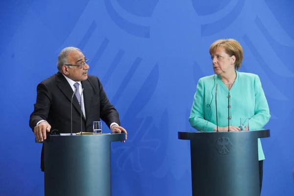  عبد المهدي وميركل خلال مؤتمرهما الصحافي في برلين اليوم