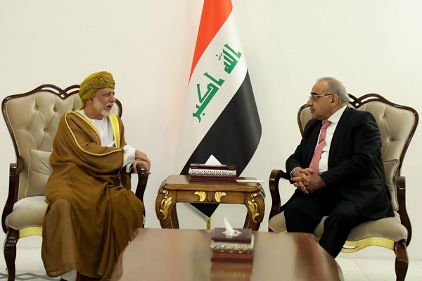 عبد المهدي وبن علوي خلال اجتماعهما في بغداد
