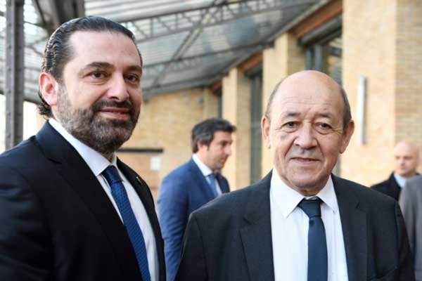  وزير الخارجية الفرنسي جان إيف لودريان ورئيس حكومة لبنان المستقيل سعد الحريري - أرشيفية