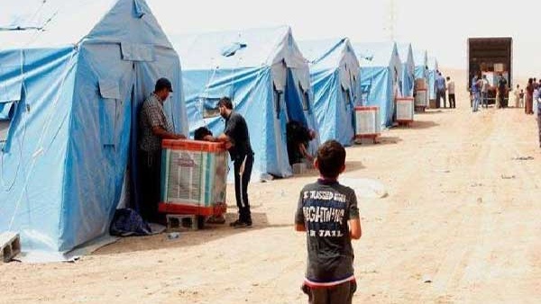 نازحون عراقيون في احد مخيماتهم حيث اعلن برنامج الغذاء العالمي الثلاثاء 21 مارس 2023 عن وقف معوناته للنازحين واللاجئين العراقيين والسوريين في العراق