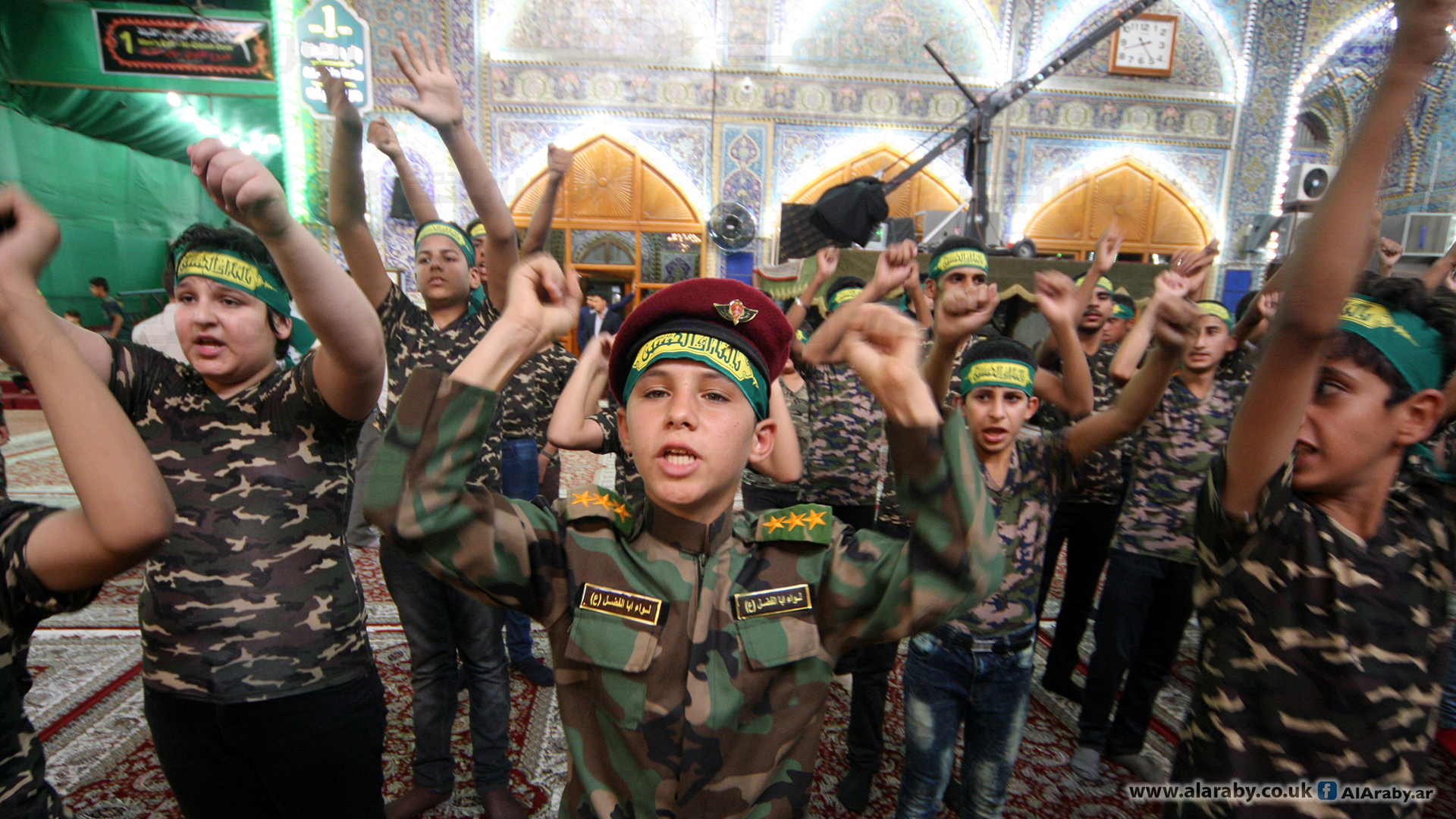 تجنيد الاطفال العراقيين من قبل المليشيات المسلحة العراقية الموالية لايران (تويتر)