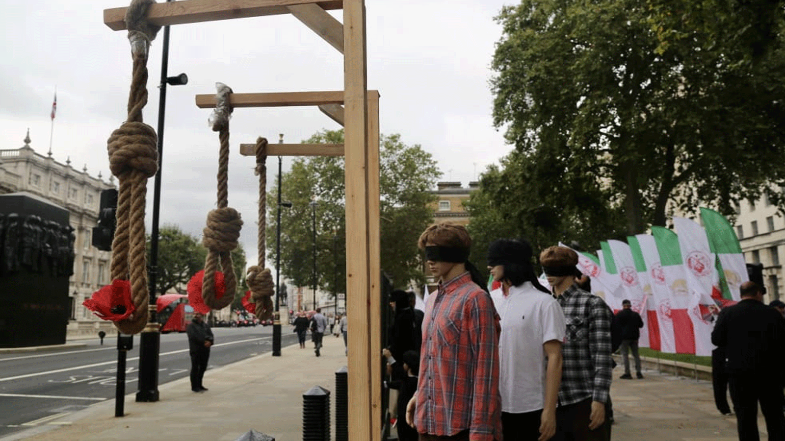 صورة أرشيفية لمتظاهرين في لندن ينظمون احتجاجًا ضد الرئيس الإيراني إبراهيم رئيسي وعمليات الإعدام في إيران. 8 أكتوبر / تشرين الأول 2021