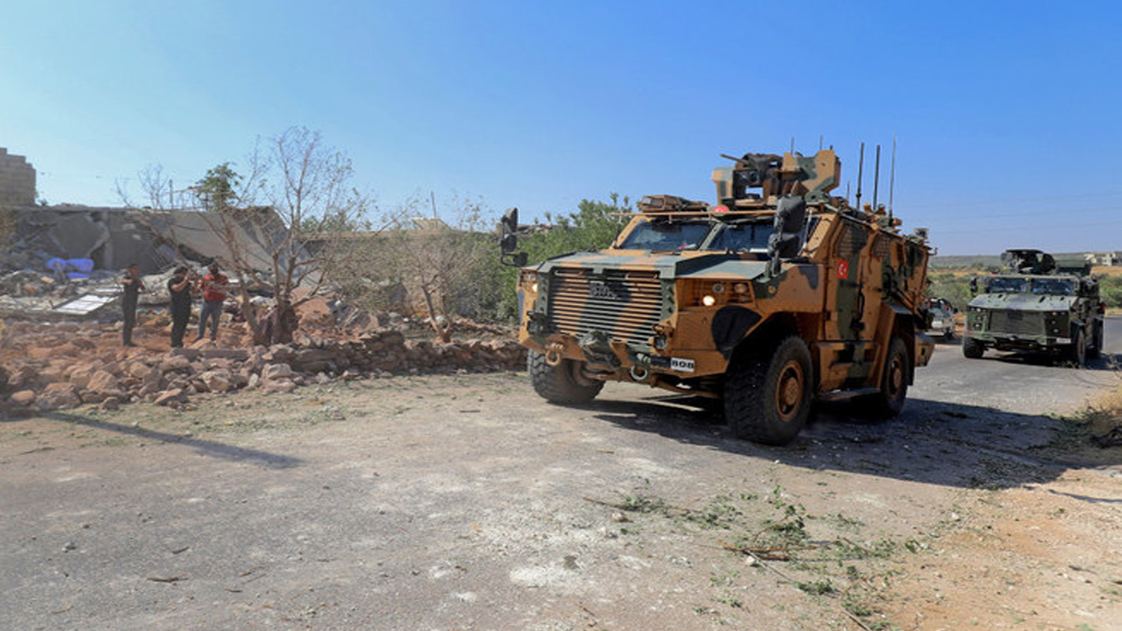 قوات تركية في ناقلات جند مدرعة تصل إلى منطقة جبل الزاوية في محافظة إدلب شمال غرب سوريا التي يسيطر عليها المتمردون في 22 تموز(يوليو) 2021