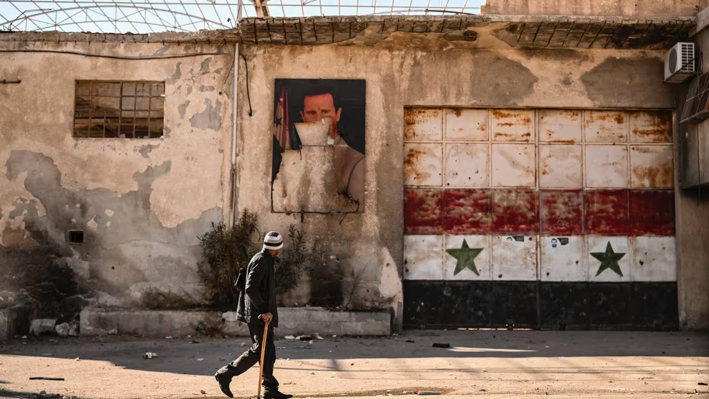 صورة مشوهة لبشار الأسد في ضواحي دمشق