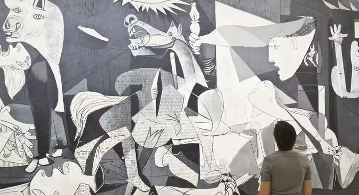 تمثل اللوحة الشهيرة لبيكاسو المذبحة التي ارتكبها النازيون في غيرنيكا