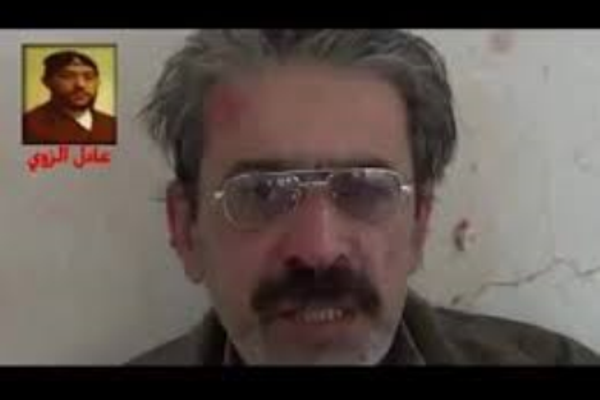 الاستاذ العراقي المختطف كما ظهر في فيديو عرضته الجماعة التي اختطفته