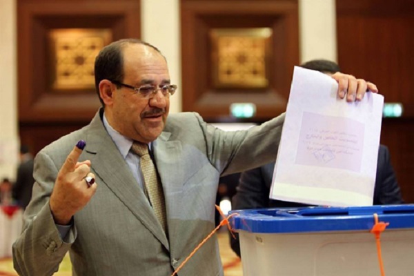نوري المالكي لحظة الإدلاء بصوته - وكالة الأنباء العراقية 