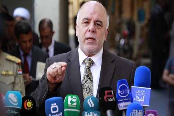 رئيس الوزراء العراقي حيدر العبادي خلال مؤتمر صحافي في النجف