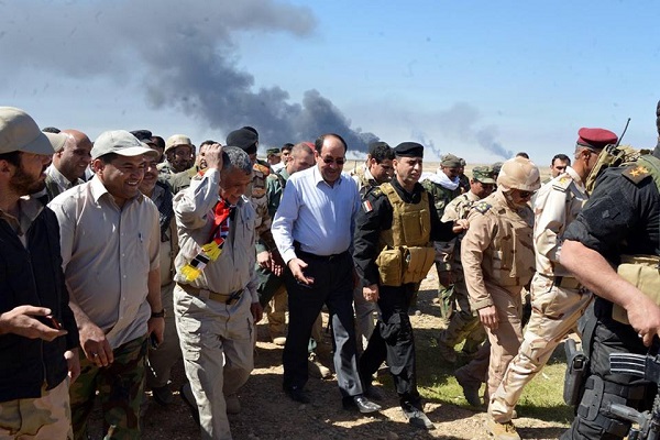 نوري المالكي في زيارة لإحدى المناطق المحررة