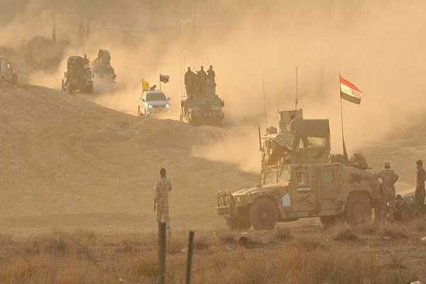  قوات عراقية بمواجهة داعش في احدى المناطق العراقية