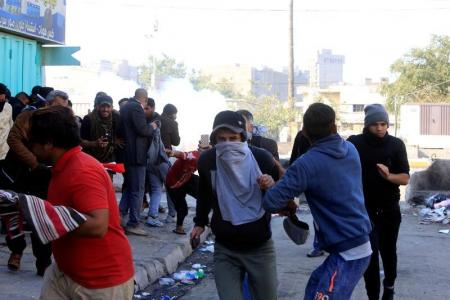 سبعة قتلى في صدامات بين متظاهرين والشرطة في بغداد