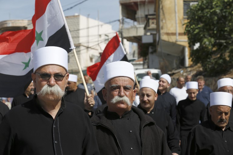 سوريو الجولان المحتل يحيون يوم الجلاء بمسيرة مؤيدة للأسد