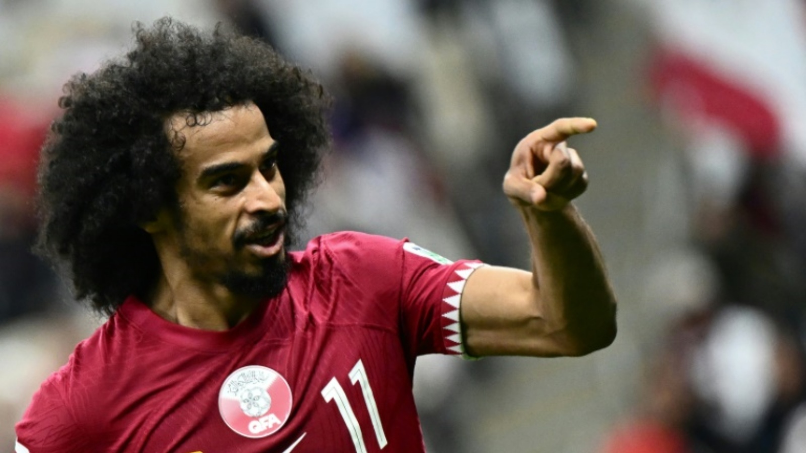 مهاجم قطر أكرم عفيف يحتفل بالتسجيل لبلاده في مرمى لبنان في المباراة الافتتاحية لكأس آسيا في كرة القدم. لوسيل، شمال الدوحة، في 12 كانون الثاني (يناير) 2024