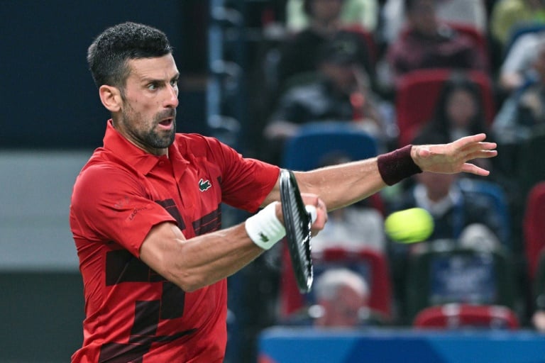 Serbia’s Novak Djokovic hits a return to Czech Republic’s Jakub Mensik during their men's singles match at the Shanghai Masters tennis tournament in Shanghai 