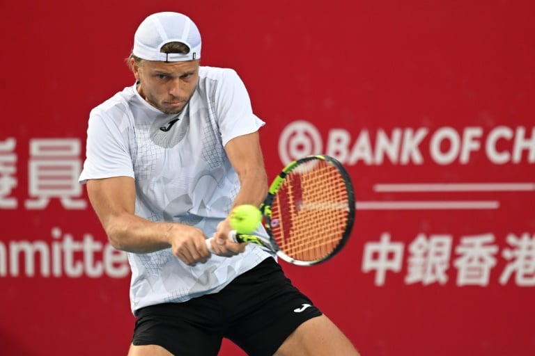 France's Alexandre Muller hits a return to Japan's Kei Nishikori during the final of the Hong Kong Open