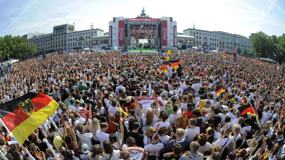 Real Madrid supporters shout slogans as they gather in Lisbon, Saturday, May 24, 2014, prior to the Champions League final soccer match between Spanish soccer teams Real Madrid and Atletico Madrid. (AP Photo/Francisco Seco)