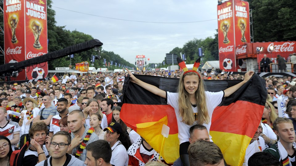 Real Madrid fans react after their team won as they watch the Champions League final soccer match between Real Madrid and Atletico Madrid, taking place in Portugal, on a giant screen at the Santiago Bernabeu stadium in Madrid, Spain, Saturday, May 24, 2014. (AP Photo/Paul White)