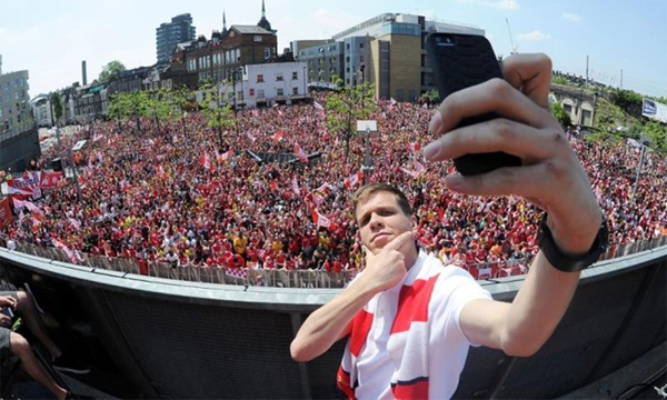 Real Madrid supporters shout slogans as they gather in Lisbon, Saturday, May 24, 2014, prior to the Champions League final soccer match between Spanish soccer teams Real Madrid and Atletico Madrid. (AP Photo/Francisco Seco)