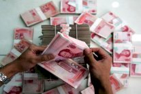 تخفيض العملة الصينية يهز البورصات العالمية