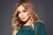 رولا سعد تُهدي محمد صلاح أغنيتها