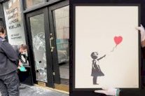 سارقا لوحة بانكسي