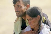 أيزيديات ينتحرن خشية السبي ومسنات يختبئن في المغارات والكلاب تتغذى على جثث النازحين