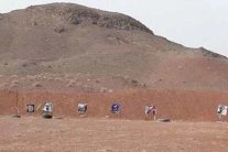 صورة العاهل السعودي ومعارضين إيرانيين هدف في الرماية