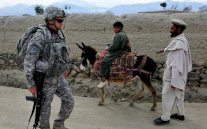 واشنطن وكابول توقعان اتفاقية تجيز بقاء قوة أميركية في أفغانستان