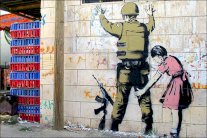 فنان غرافيتي بريطاني يرسم معاناة غزة جداريات