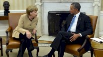 اوباما وميركل يطالبان بابقاء العقوبات على موسكو