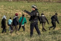 ميركل: تركيا ملتزمة بالحد من تدفق اللاجئين