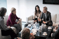 جورج كلوني يناقش قضية اللاجئين مع ميركل