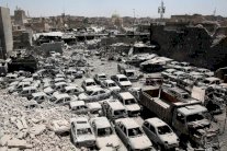 عشرات الاحياء مع الجثث تحت الانقاض في الموصل