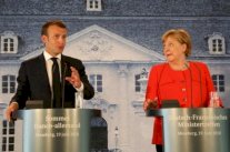 ماكرون في ألمانيا يدعم ميركل ويدعو إلى رقابة أكبر على المهاجرين