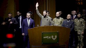 الرئيس السوري أحمد الشرع يلقي خطابا مساء الاثنين 8 ديسمبر/كانون الأول 2025 في قصر المؤتمرات في دمشق في الذكرى الأولى لسقوط بشار الأسد - Reuters