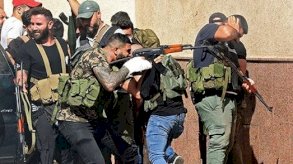 عناصر لحزب الله يشاركون في الاشتباكات التي اندلعت في بيروت الخميس